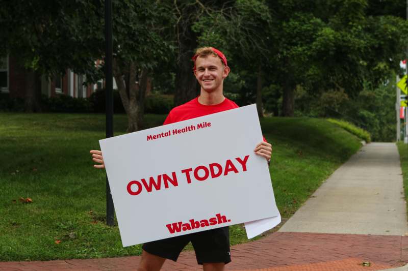 a man holding a sign