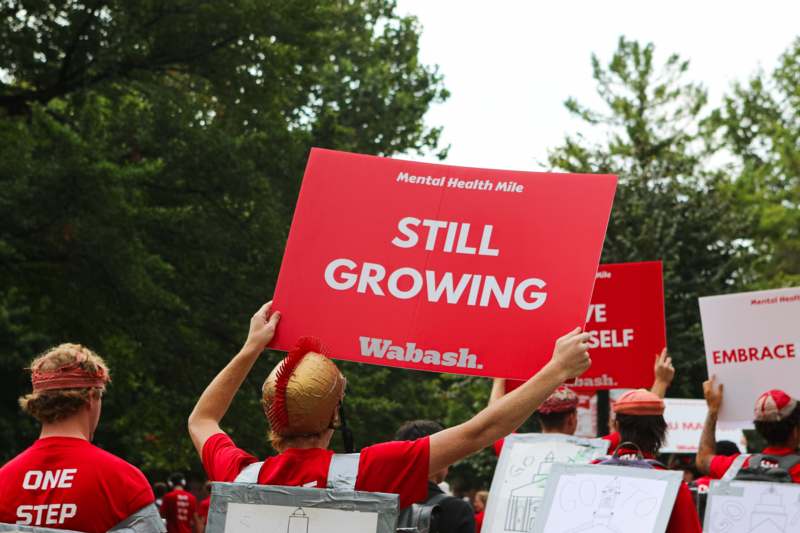 a group of people holding signs