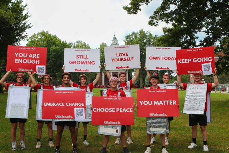 a group of people holding signs