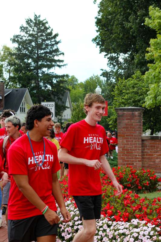 a group of people in red shirts