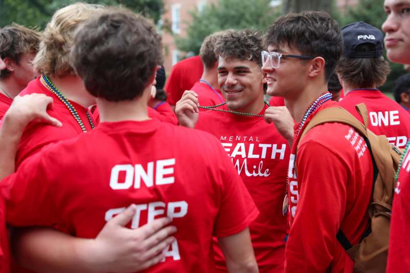 a group of people wearing red shirts