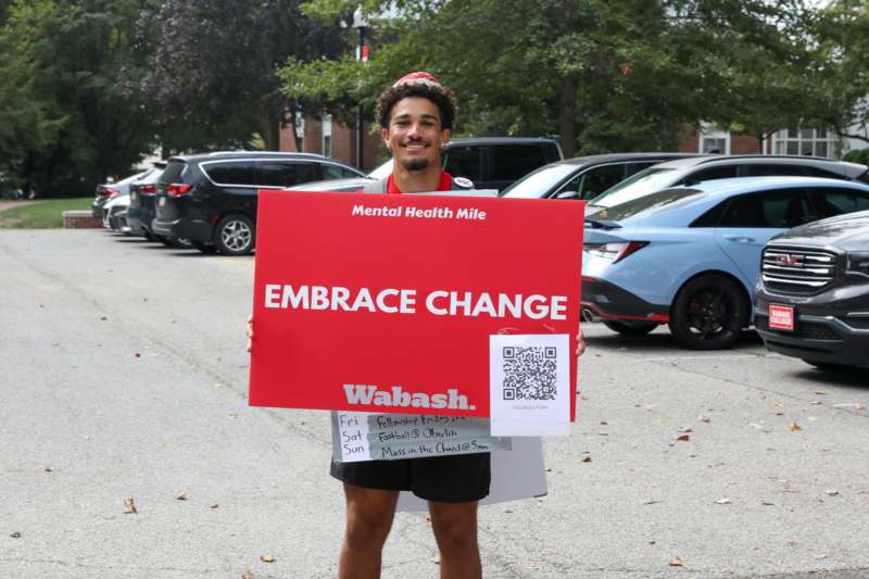 a man holding a sign