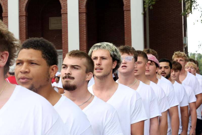 2026 Chapel Sing - a group of men in white shirts