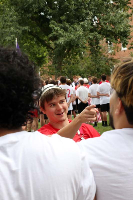 a man pointing at another man