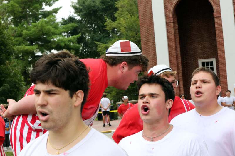 a group of men wearing matching outfits