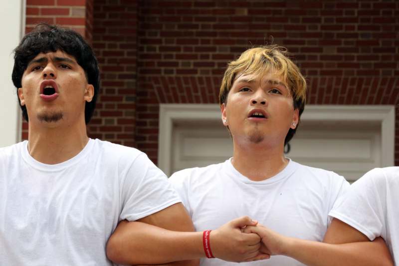 two men in white shirts