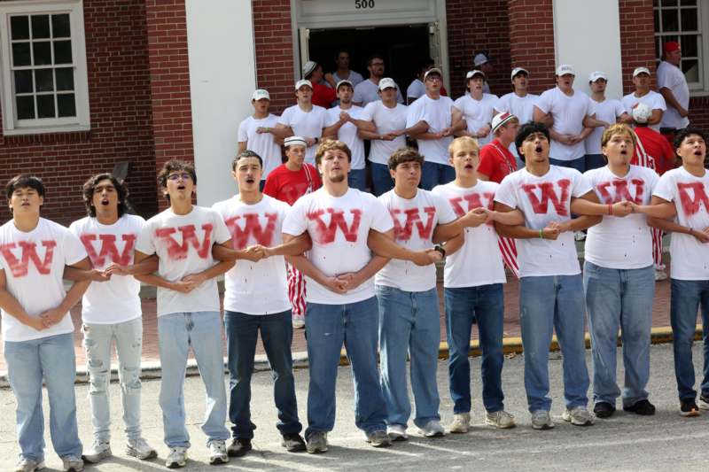a group of people standing in front of a building