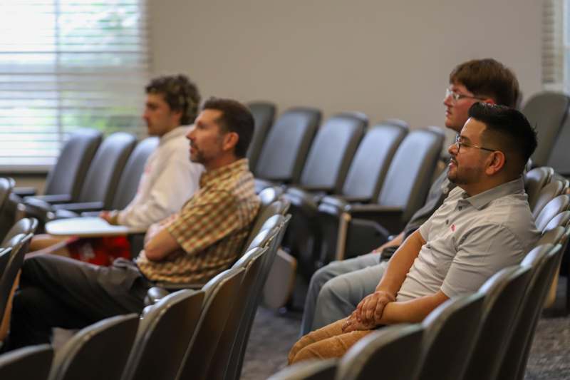 a group of people sitting in chairs