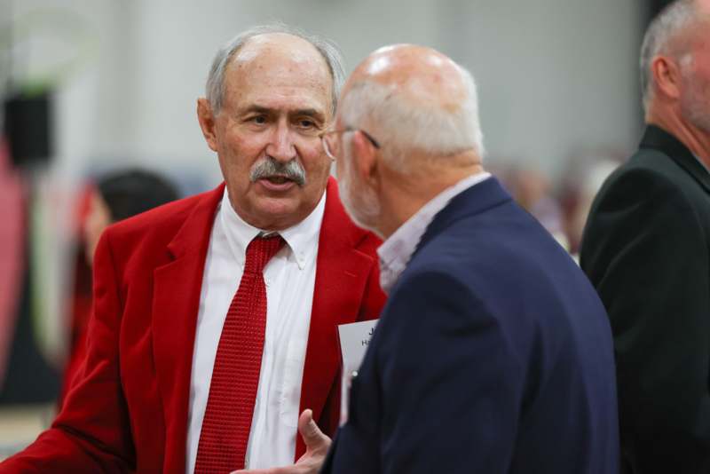 two men in suits talking