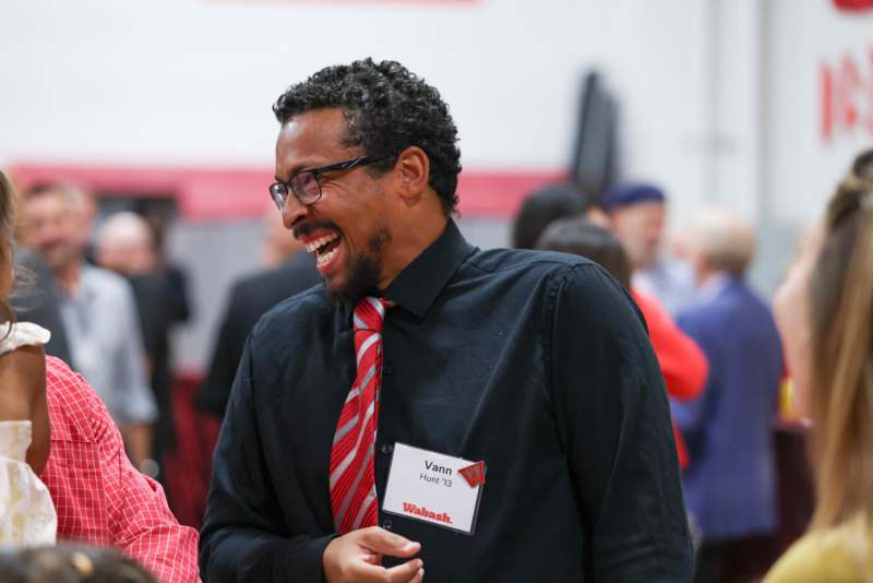 a man laughing at a business event
