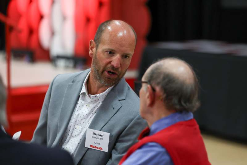 a man talking to another man