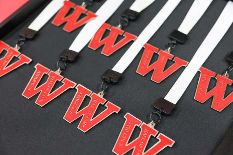 a group of red and white lanyards