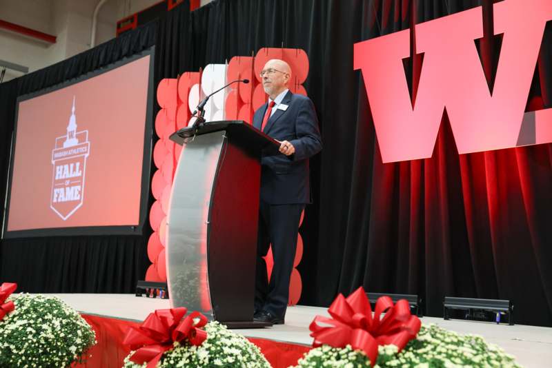 a man standing at a podium