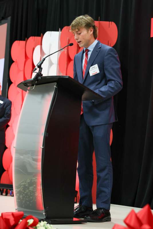 a man standing at a podium
