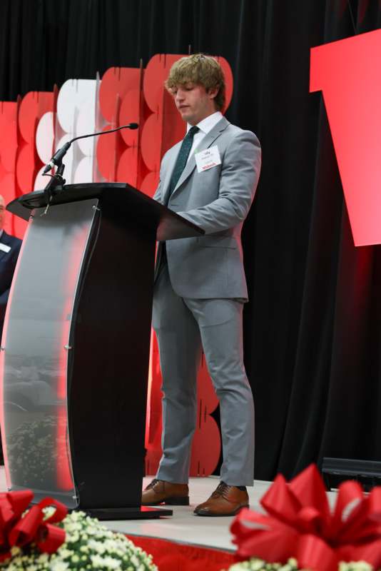 a man standing at a podium