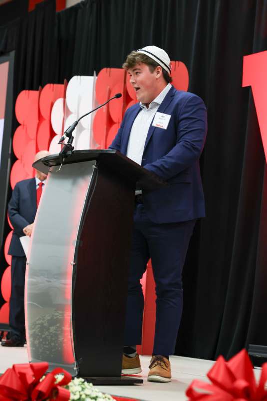 a man standing at a podium