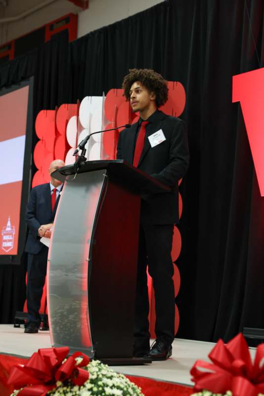 a man standing at a podium