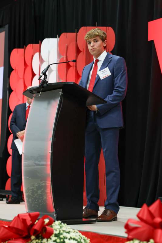 a man standing at a podium