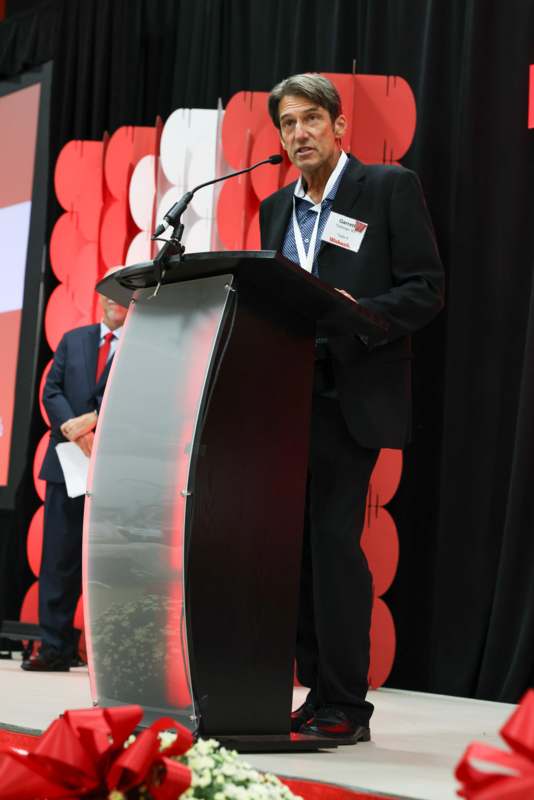 a man standing at a podium
