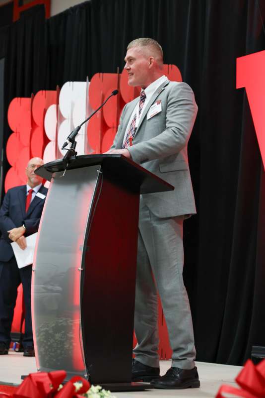 a man standing at a podium