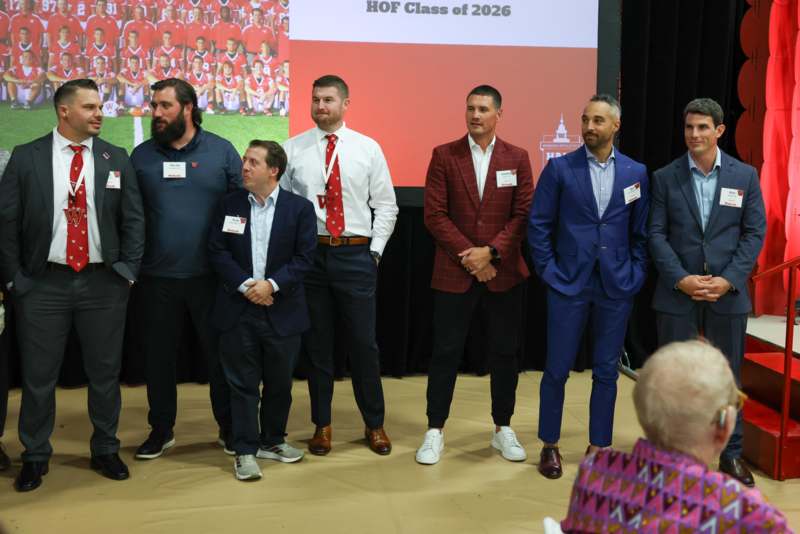a group of men standing on a stage
