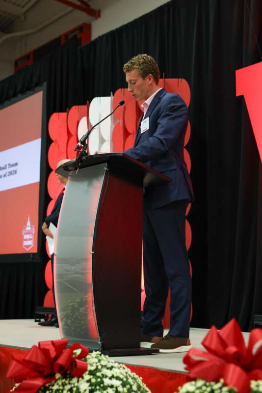 a man standing at a podium