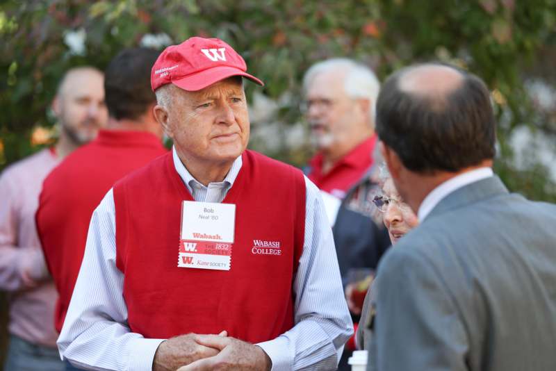 a man in a red hat and vest