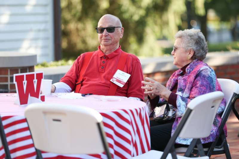 a man and woman sitting at a table