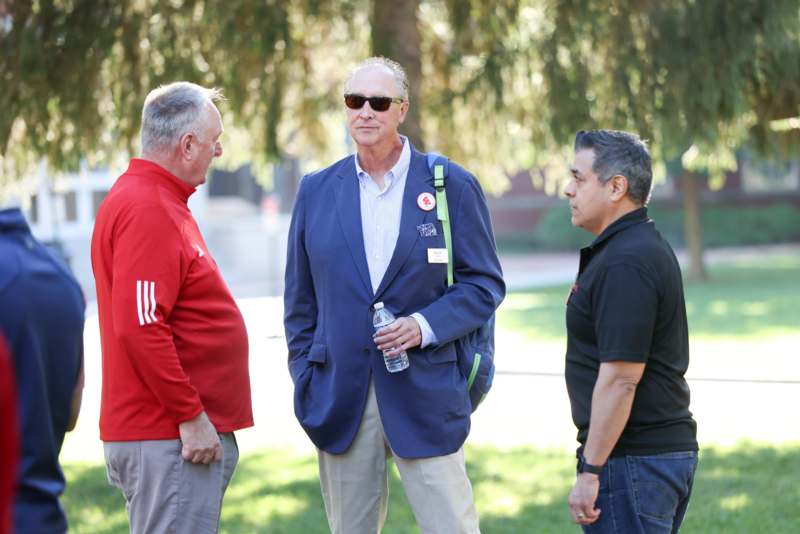 a group of men standing outside