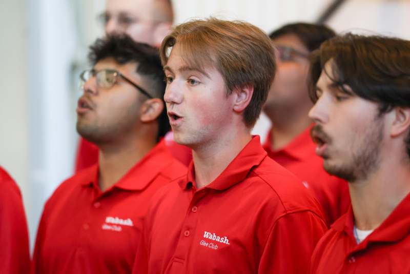 a group of men wearing red shirts