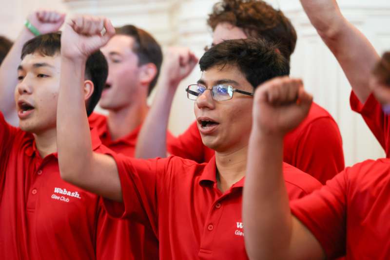 a group of people in red shirts