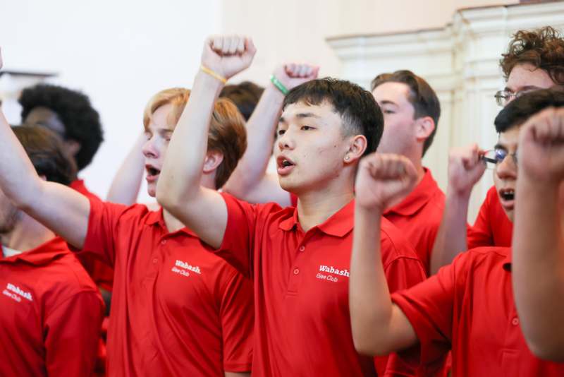a group of people in red shirts