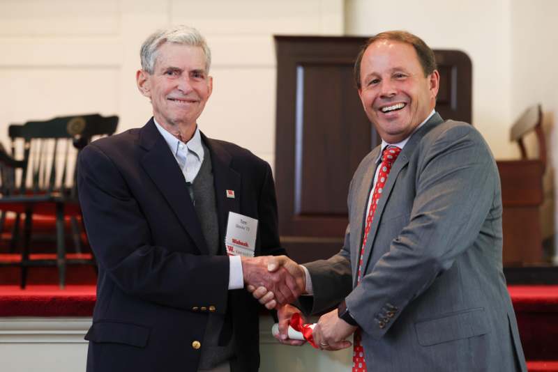 a man shaking hands with another man