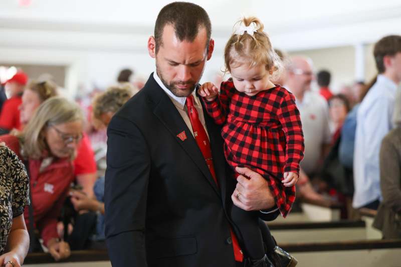 a man holding a child