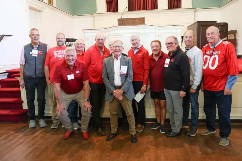 a group of men posing for a photo