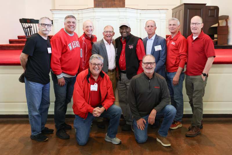 a group of men posing for a photo