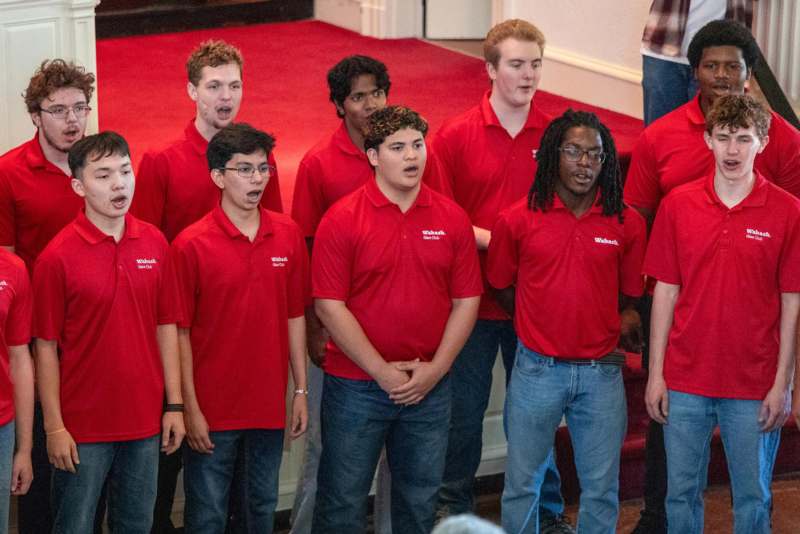a group of people wearing red shirts