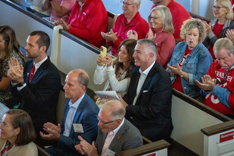 a group of people sitting in pews