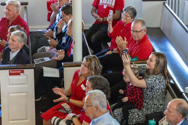 a group of people clapping