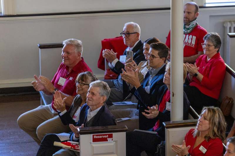 a group of people clapping
