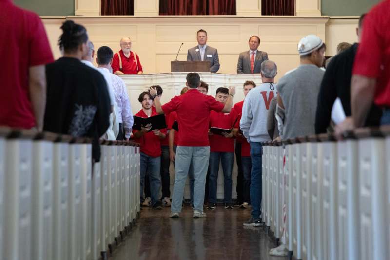 a group of people standing in a room