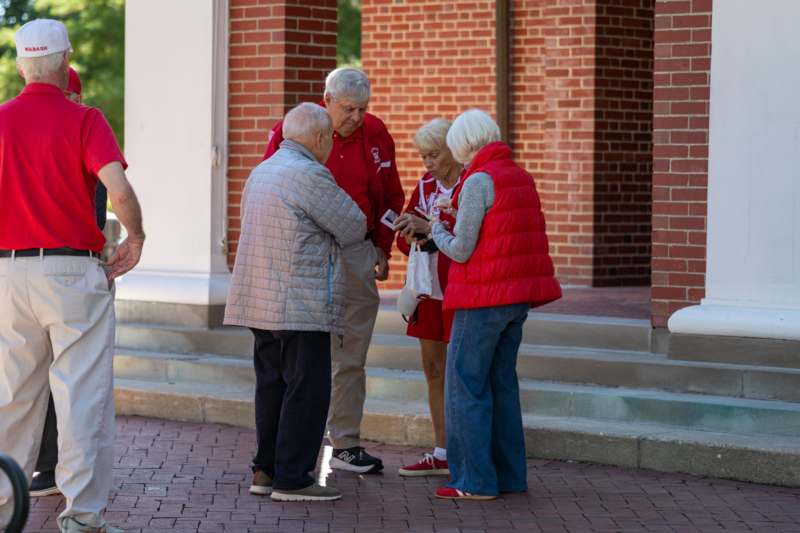 a group of people standing outside a building