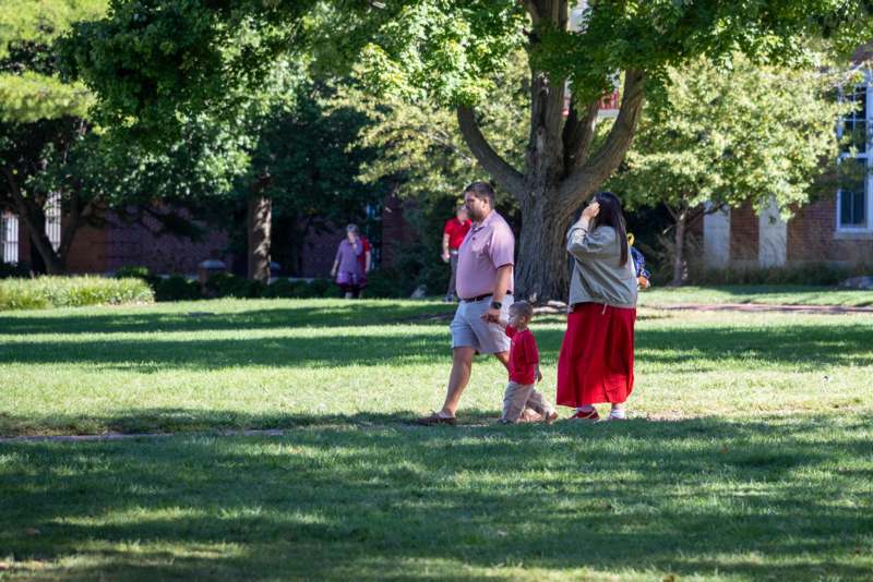a group of people walking in a park