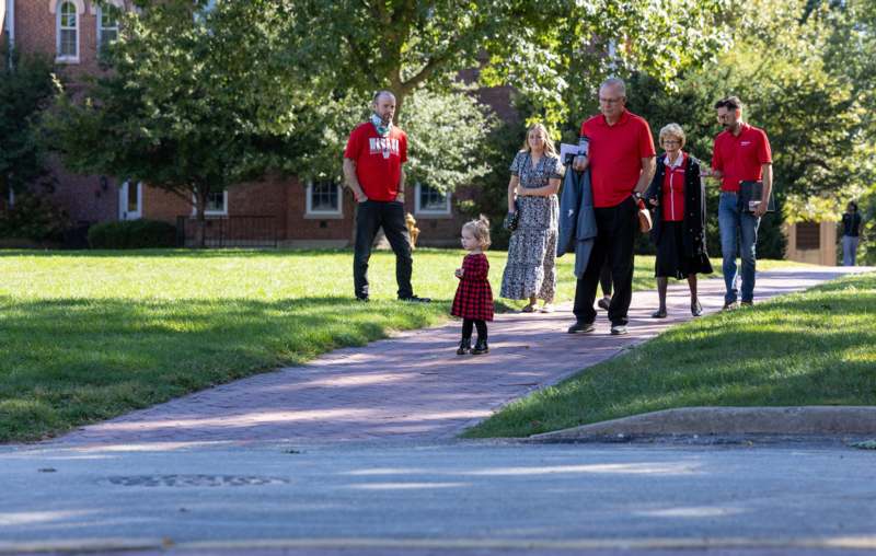 a group of people walking on a path