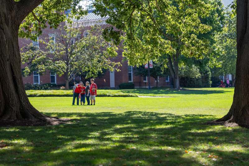 a group of kids standing in a field