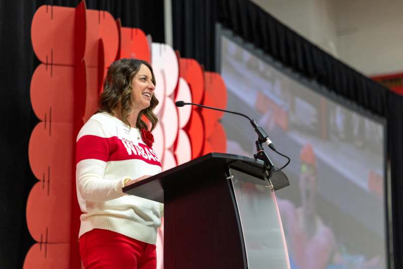 a woman standing at a podium
