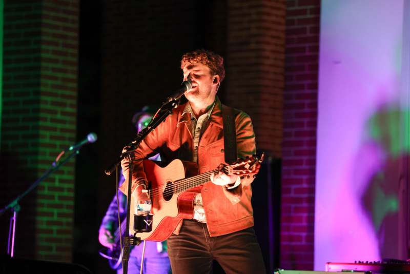 a man singing into a microphone
