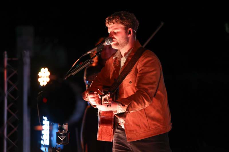 a man singing into a microphone