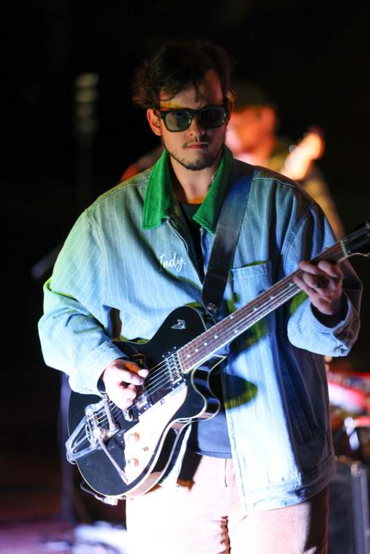 a man playing a guitar