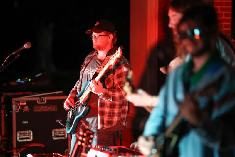 a man playing guitar on stage